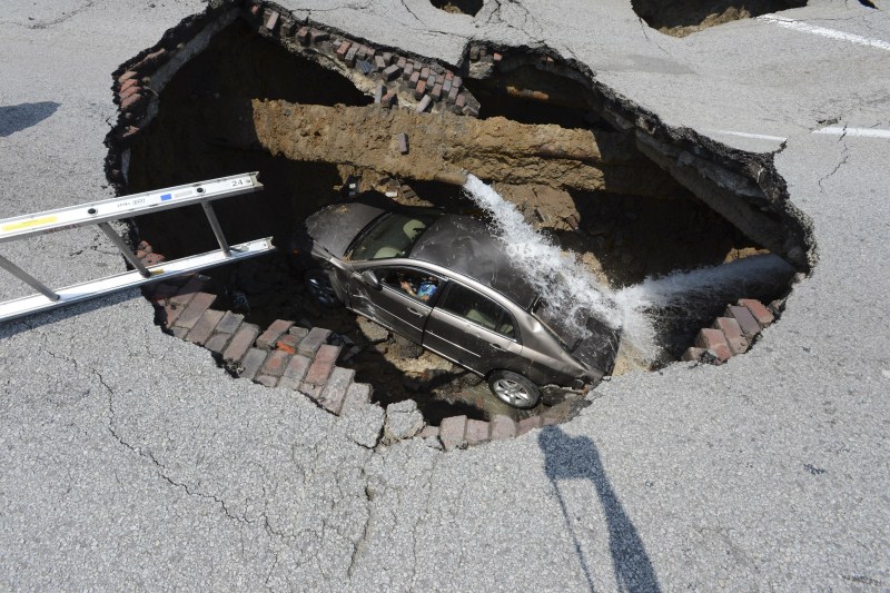 Sinkholes can be deadly - swallowing residents and damaging infrastructure. Sinkholes,Giant Sinkholes,deadly Sinkholes,Sinkholes Around the World,biggest Sinkholes