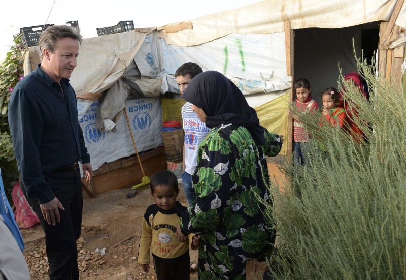 Prime Minister David Cameron visits a Syrian refugee settlement camp in the Bekaa Valley in Lebanon, September 14, 2015. David Cameron,David Cameron meets refugees in Lebanon camp,Prime Minister David Cameron,Bekaa Valley in Lebanon,Bekaa Valley,Lebanon,refugees,Syrian refugee