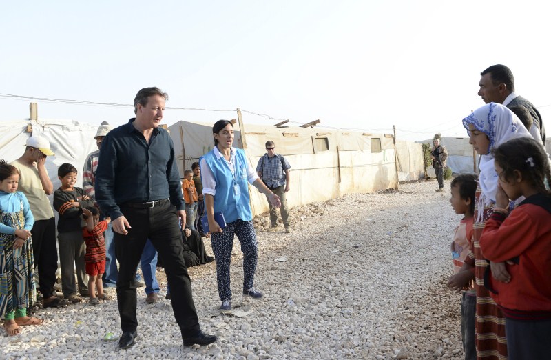 Prime Minister David Cameron visits a Syrian refugee settlement camp in the Bekaa Valley in Lebanon, September 14, 2015. David Cameron,David Cameron meets refugees in Lebanon camp,Prime Minister David Cameron,Bekaa Valley in Lebanon,Bekaa Valley,Lebanon,refugees,Syrian refugee