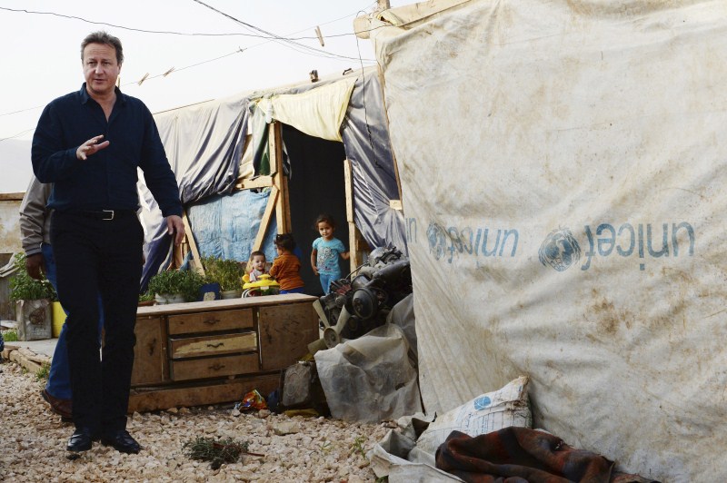 Prime Minister David Cameron visits a Syrian refugee settlement camp in the Bekaa Valley in Lebanon, September 14, 2015. David Cameron,David Cameron meets refugees in Lebanon camp,Prime Minister David Cameron,Bekaa Valley in Lebanon,Bekaa Valley,Lebanon,refugees,Syrian refugee