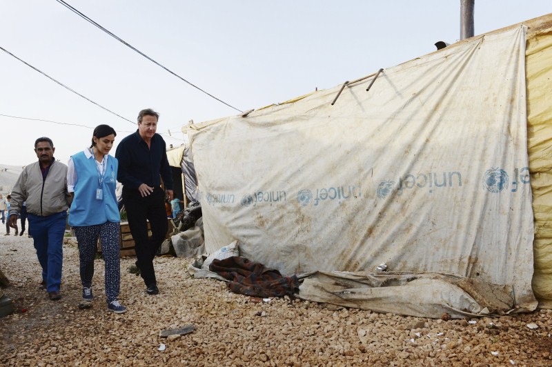 Prime Minister David Cameron visits a Syrian refugee settlement camp in the Bekaa Valley in Lebanon, September 14, 2015. David Cameron,David Cameron meets refugees in Lebanon camp,Prime Minister David Cameron,Bekaa Valley in Lebanon,Bekaa Valley,Lebanon,refugees,Syrian refugee