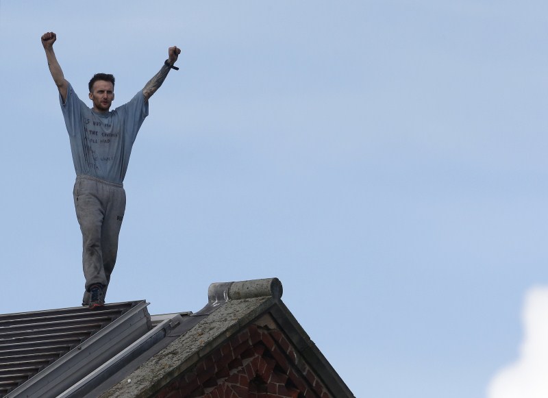 Prisoner Stuart Horner, a convicted murderer, has spent two nights on the roof of Manchester's 'Strangeways' prison to protest conditions inside the jail. Stuart Horner,Prison Roof Protest,Roof Protest,killer Stuart Horner,Manchester,Strangeways
