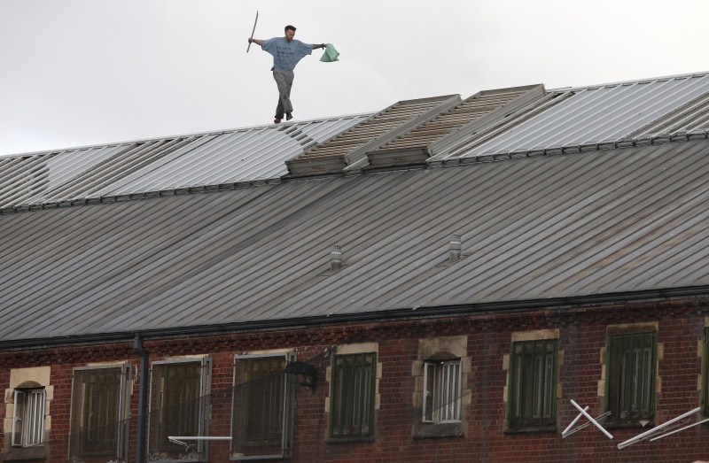 Prisoner Stuart Horner, a convicted murderer, has spent two nights on the roof of Manchester's 'Strangeways' prison to protest conditions inside the jail. Stuart Horner,Prison Roof Protest,Roof Protest,killer Stuart Horner,Manchester,Strangeways