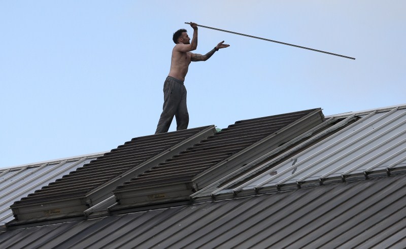 Prisoner Stuart Horner, a convicted murderer, has spent two nights on the roof of Manchester's 'Strangeways' prison to protest conditions inside the jail. Stuart Horner,Prison Roof Protest,Roof Protest,killer Stuart Horner,Manchester,Strangeways