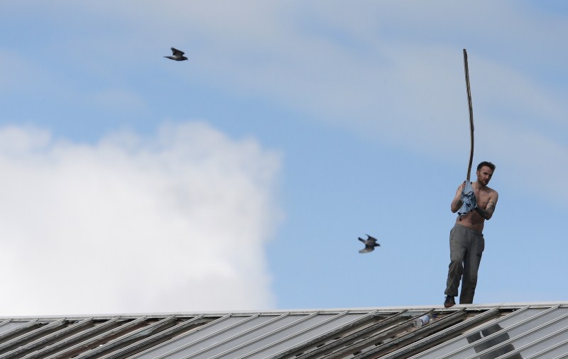 Prisoner Stuart Horner, a convicted murderer, has spent two nights on the roof of Manchester's 'Strangeways' prison to protest conditions inside the jail. Stuart Horner,Prison Roof Protest,Roof Protest,killer Stuart Horner,Manchester,Strangeways