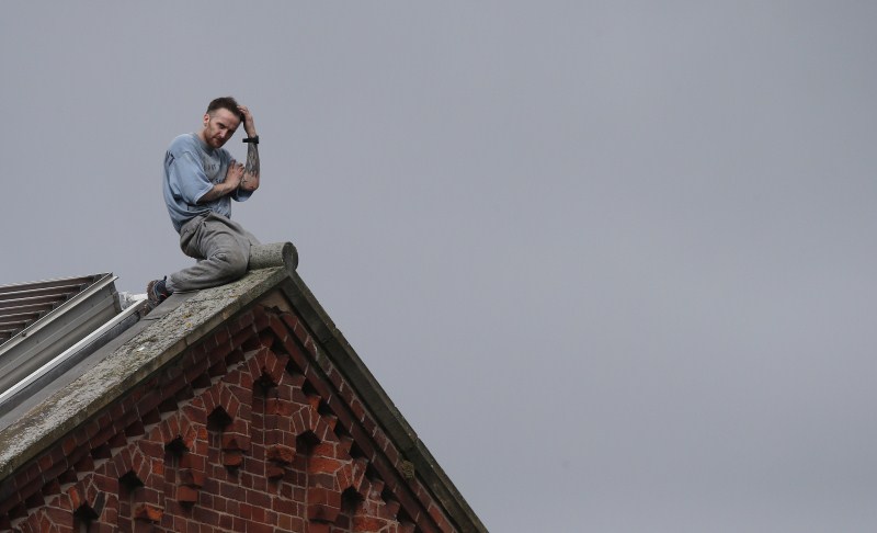 Prisoner Stuart Horner, a convicted murderer, has spent two nights on the roof of Manchester's 'Strangeways' prison to protest conditions inside the jail. Stuart Horner,Prison Roof Protest,Roof Protest,killer Stuart Horner,Manchester,Strangeways
