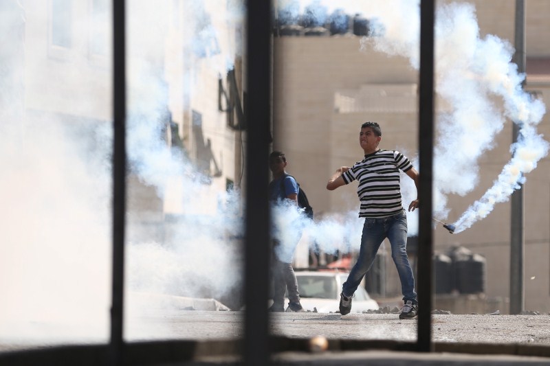Jerusalem has seen days of clashes after Israeli police fired stun grenades and tear gas at rock-throwing Palestinians who barricaded themselves inside al-Aqsa mosque. Israeli police,Palestinians in Jerusalem,Clashes in Jerusalem,al-Aqsa mosque,Palestinian protester
