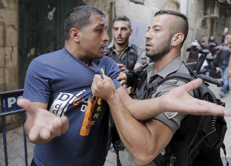 Jerusalem has seen days of clashes after Israeli police fired stun grenades and tear gas at rock-throwing Palestinians who barricaded themselves inside al-Aqsa mosque. Israeli police,Palestinians in Jerusalem,Clashes in Jerusalem,al-Aqsa mosque,Palestinian protester