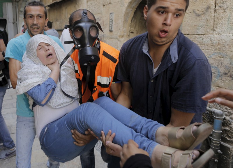 Jerusalem has seen days of clashes after Israeli police fired stun grenades and tear gas at rock-throwing Palestinians who barricaded themselves inside al-Aqsa mosque. Israeli police,Palestinians in Jerusalem,Clashes in Jerusalem,al-Aqsa mosque,Palestinian protester