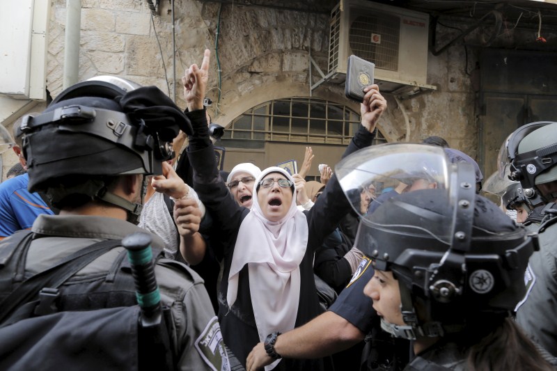 Jerusalem has seen days of clashes after Israeli police fired stun grenades and tear gas at rock-throwing Palestinians who barricaded themselves inside al-Aqsa mosque. Israeli police,Palestinians in Jerusalem,Clashes in Jerusalem,al-Aqsa mosque,Palestinian protester