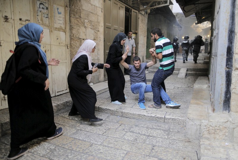 Jerusalem has seen days of clashes after Israeli police fired stun grenades and tear gas at rock-throwing Palestinians who barricaded themselves inside al-Aqsa mosque. Israeli police,Palestinians in Jerusalem,Clashes in Jerusalem,al-Aqsa mosque,Palestinian protester