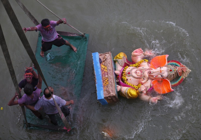 Vinayaka Chaturthi or Ganesh Chaturthi celebrations end with the immersion or Visarjan of clay Ganapati idol in water. Ganesh idol immersion,Ganesh idol immersion 2015,Ganesh immersion,Ganesh Chaturthi,Ganesh Chaturthi 2015,Visarjan,Ganpati Visarjan,Ganapati idol in water