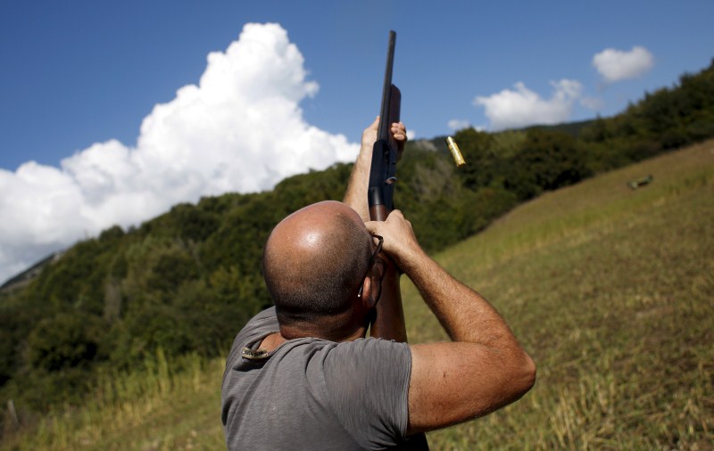 As the sun rises, hunters trek into the fields for the first day of the season in Castell'Azzara, Italy. First day of the Italy hunting season,Italy hunting season,Hunting season in Italy,Hunting in Italy