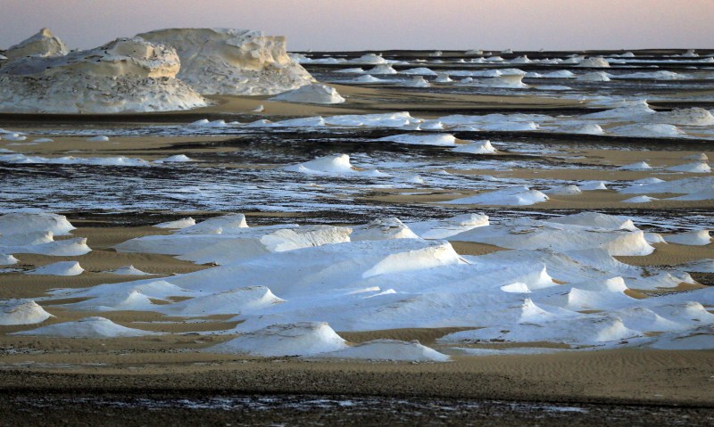 The White Desert features limestone and chalk forms strangely shaped by the wind and sand. Egypt White Desert,White Desert,Tourist Place,Tourist Place around the world,Tourist Place around world,world Tourist Place,Tourist Place pics,Tourist Place images,Tourist Place photos,White Desert pics,White Desert images,White Desert photos,White Desert
