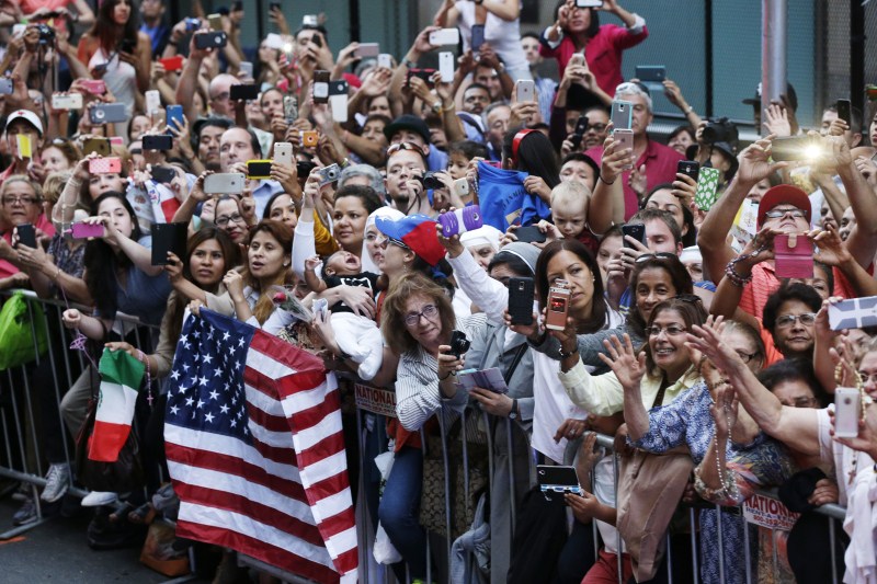 People wait for Pope Francis to appear from the Speaker's Balcony on Capitol Hill in Washington, Thursday. The Pope will address a joint meeting of Congress making him the first pontiff in history to do so. Crowds For Francis,Glimpse of Pope Francis,Pope Francis,Washington,Pope Francis New York Tour,Pope Francis in New York,Capitol Hill