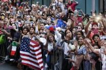 People wait for Pope Francis to appear from the Speaker's Balcony on Capitol Hill in Washington, Thursday. The Pope will address a joint meeting of Congress making him the first pontiff in history to do so.