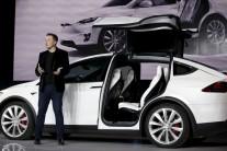 Tesla Motors delivered the first of its long-awaited Model X electric sports-utility vehicles on Tuesday, a product investors are counting on to make the pioneering company profitable after years of losses.