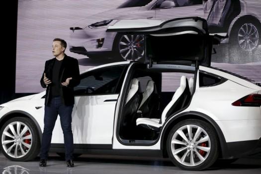 Tesla Motors delivered the first of its long-awaited Model X electric sports-utility vehicles on Tuesday, a product investors are counting on to make the pioneering company profitable after years of losses.