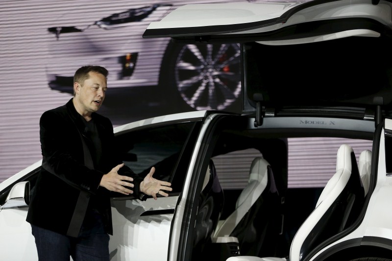 Tesla Motors delivered the first of its long-awaited Model X electric sports-utility vehicles on Tuesday, a product investors are counting on to make the pioneering company profitable after years of losses. Tesla,Model X,Model X electric car,electric car,car,luxury carmakers,luxury car,sports car,First SUV,Tesla CEO Elon Musk,Elon Musk,Tesla Elon Musk,Tesla Motors