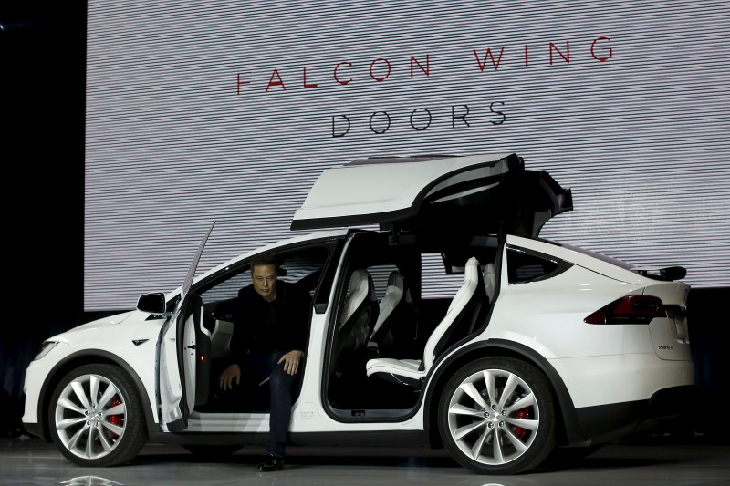 Tesla Motors delivered the first of its long-awaited Model X electric sports-utility vehicles on Tuesday, a product investors are counting on to make the pioneering company profitable after years of losses. Tesla,Model X,Model X electric car,electric car,car,luxury carmakers,luxury car,sports car,First SUV,Tesla CEO Elon Musk,Elon Musk,Tesla Elon Musk,Tesla Motors