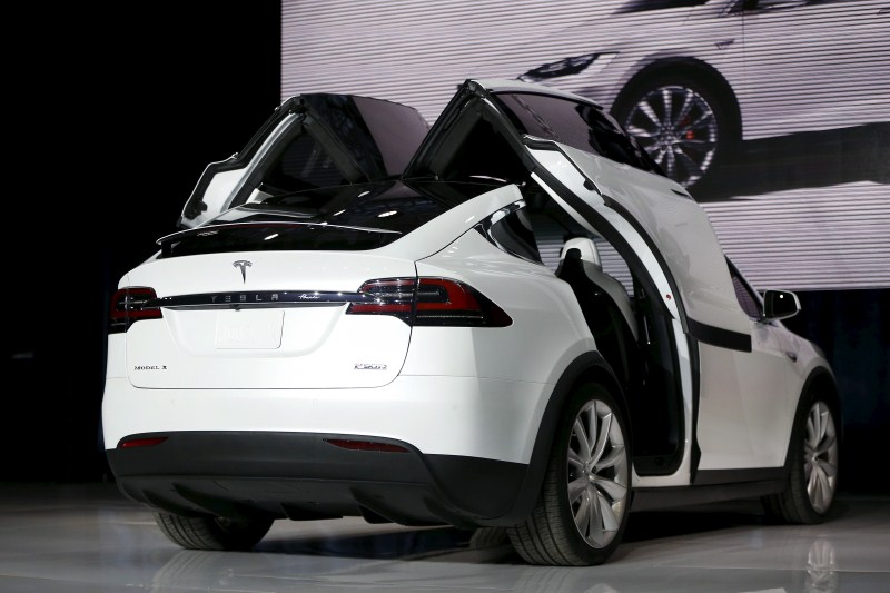 Tesla Motors delivered the first of its long-awaited Model X electric sports-utility vehicles on Tuesday, a product investors are counting on to make the pioneering company profitable after years of losses. Tesla,Model X,Model X electric car,electric car,car,luxury carmakers,luxury car,sports car,First SUV,Tesla CEO Elon Musk,Elon Musk,Tesla Elon Musk,Tesla Motors