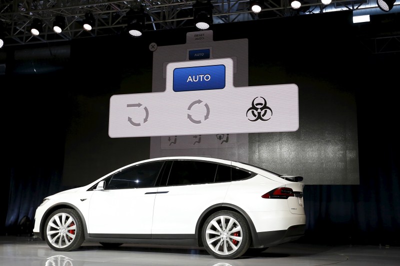 Tesla Motors delivered the first of its long-awaited Model X electric sports-utility vehicles on Tuesday, a product investors are counting on to make the pioneering company profitable after years of losses. Tesla,Model X,Model X electric car,electric car,car,luxury carmakers,luxury car,sports car,First SUV,Tesla CEO Elon Musk,Elon Musk,Tesla Elon Musk,Tesla Motors