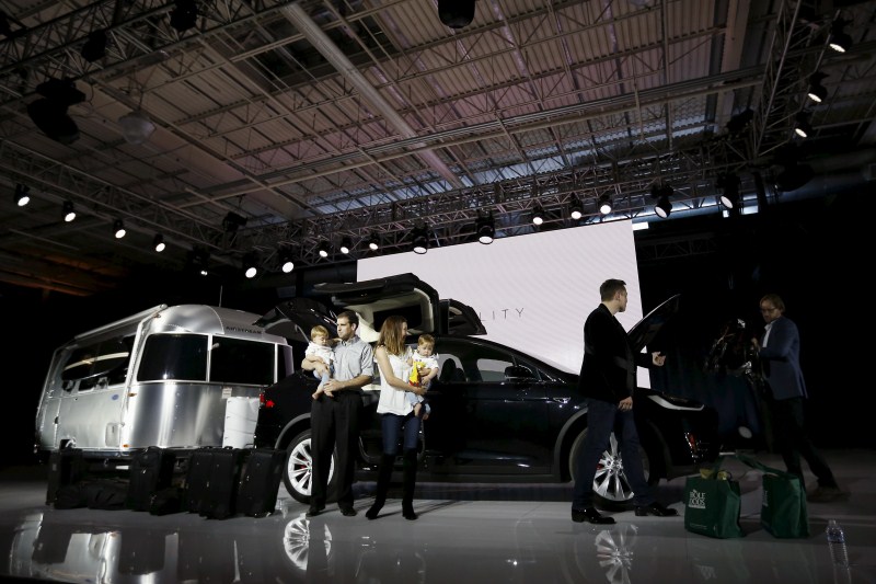 Tesla Motors delivered the first of its long-awaited Model X electric sports-utility vehicles on Tuesday, a product investors are counting on to make the pioneering company profitable after years of losses. Tesla,Model X,Model X electric car,electric car,car,luxury carmakers,luxury car,sports car,First SUV,Tesla CEO Elon Musk,Elon Musk,Tesla Elon Musk,Tesla Motors