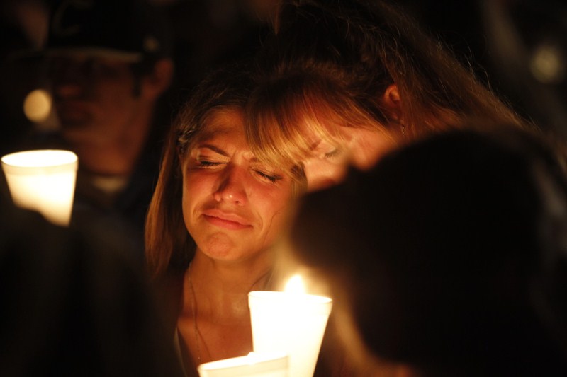 The aftermath of the shooting at Umpqua Community College in Roseburg, Oregon. Oregon school shooting,Oregon shooting,school shooting,Candlelight prayer at Roseburg's Stewart Park,Candlelight prayer,Roseburg's Stewart Park,Umpqua Community College,Umpqua College