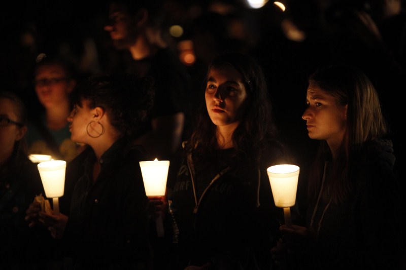 The aftermath of the shooting at Umpqua Community College in Roseburg, Oregon. Oregon school shooting,Oregon shooting,school shooting,Candlelight prayer at Roseburg's Stewart Park,Candlelight prayer,Roseburg's Stewart Park,Umpqua Community College,Umpqua College