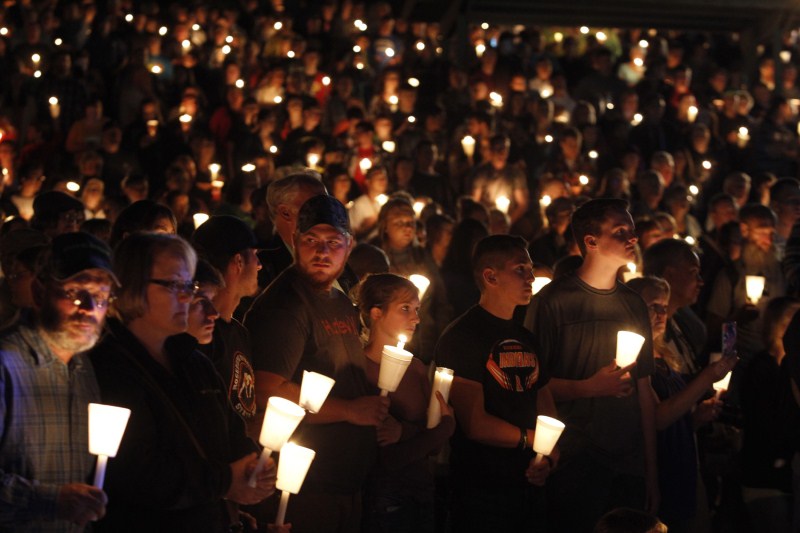The aftermath of the shooting at Umpqua Community College in Roseburg, Oregon. Oregon school shooting,Oregon shooting,school shooting,Candlelight prayer at Roseburg's Stewart Park,Candlelight prayer,Roseburg's Stewart Park,Umpqua Community College,Umpqua College