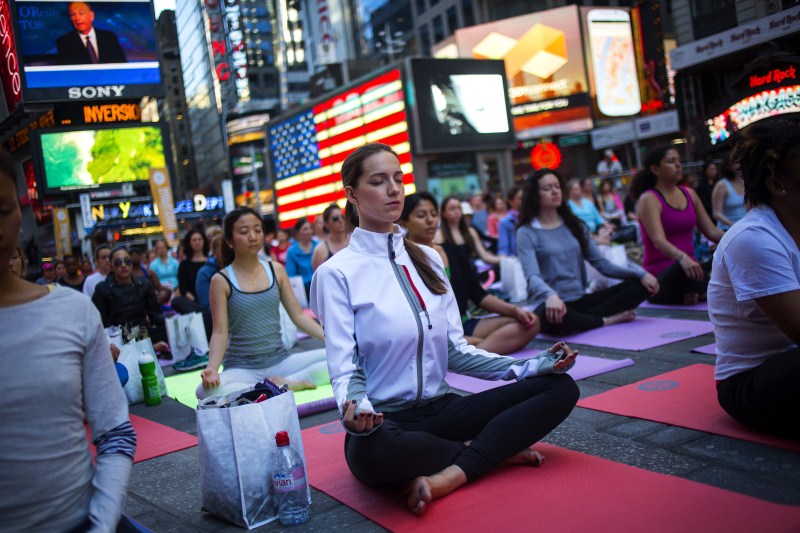 From museums to Times Square - yoga being practiced in unusual places. Yoga,Yoga in unexpected places,Yoga practices,different type of yoga,Performing yoga at unexpected places