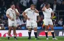 Hosts England was eliminated from the Rugby World Cup at the pool stage for the first time after a humiliating 33-13 defeat against Australia that sends the Wallabies and Wales through to the quarterfinals.