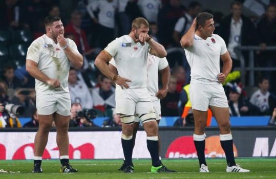 Hosts England was eliminated from the Rugby World Cup at the pool stage for the first time after a humiliating 33-13 defeat against Australia that sends the Wallabies and Wales through to the quarterfinals.