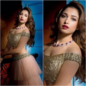 Cute Tamannah looks gorgeous in Manish Malhotra's designs with wavy hair and glossy red lips.