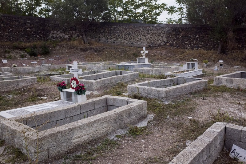 Drowned migrants are laid to rest in the pauper's section of a cemetery on the Greek island of Lesbos. Greece's Lesbos for refugees lost at sea,refugees lost at sea,Greece Lesbos,Drowned migrants,migrants,Greek island