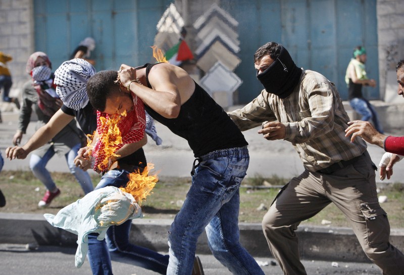 Seven Israelis and 27 Palestinians, including nine alleged attackers and eight children, have died in almost two weeks of street attacks and security crackdowns. The violence has been stirred in part by Muslim anger over increasing Jewish visits to the al-Aqsa mosque compound in Jerusalem, Islam's holiest site outside the Arabian Peninsula. Palestinian-Israeli tensions,Israelis,Palestinians,Muslim anger,al-Aqsa mosque,Jewish,Arabian Peninsula