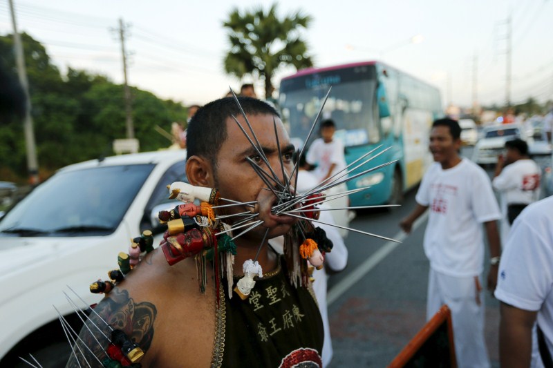 Vegetarian festival, featuring face-piercing, spirit mediums and strict vegetarianism celebrates the local Chinese community's belief that abstinence from meat and various stimulants during the ninth lunar month of the Chinese calendar will help them obtain good health and peace of mind. Vegetarian festival,Vegetarian festival celebrated across Thailand,Vegetarian festival in Thailand,Vegetarian festival 2015,annual vegetarian festival in Phuket,annual vegetarian festival,Extreme Vegetarianism,Phuket Thailand