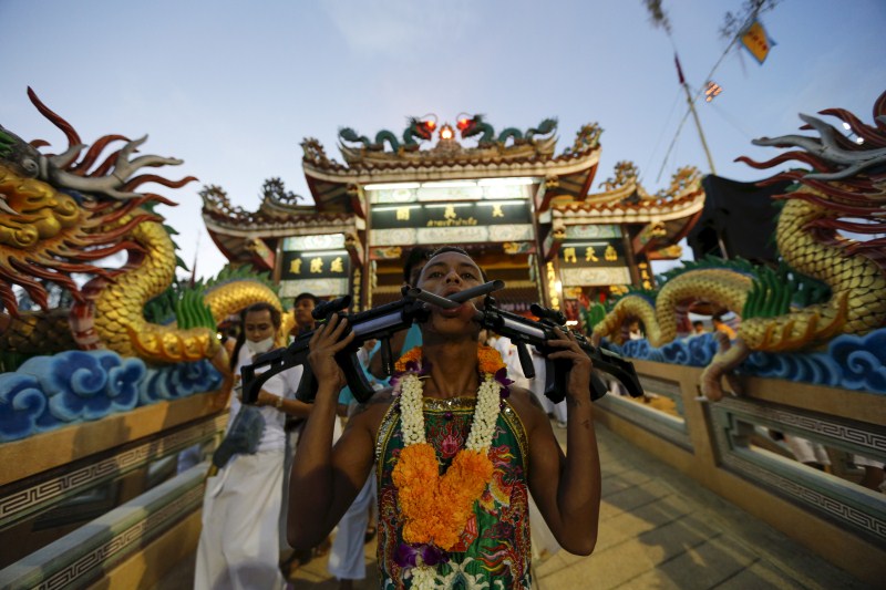 Vegetarian festival, featuring face-piercing, spirit mediums and strict vegetarianism celebrates the local Chinese community's belief that abstinence from meat and various stimulants during the ninth lunar month of the Chinese calendar will help them obtain good health and peace of mind. Vegetarian festival,Vegetarian festival celebrated across Thailand,Vegetarian festival in Thailand,Vegetarian festival 2015,annual vegetarian festival in Phuket,annual vegetarian festival,Extreme Vegetarianism,Phuket Thailand