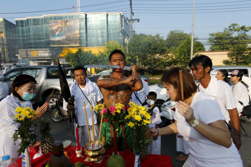Vegetarian festival, featuring face-piercing, spirit mediums and strict vegetarianism celebrates the local Chinese community's belief that abstinence from meat and various stimulants during the ninth lunar month of the Chinese calendar will help them obtain good health and peace of mind. Vegetarian festival,Vegetarian festival celebrated across Thailand,Vegetarian festival in Thailand,Vegetarian festival 2015,annual vegetarian festival in Phuket,annual vegetarian festival,Extreme Vegetarianism,Phuket Thailand
