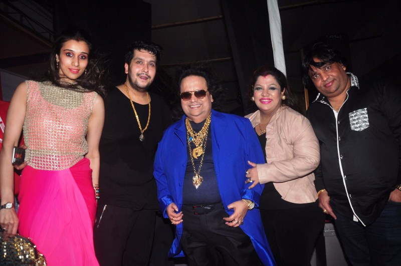 Music composer Bappi Lahiri performs with celebs at the North Bombay Sarbojanin Durga Puja. Bappi Lahiri,music composer Bappi Lahiri,Durga Puja,Durga Puja celebration,Durga Puja 2015