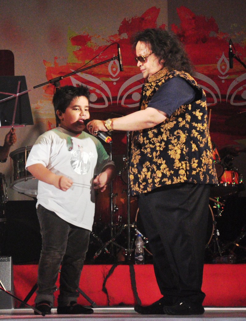 Music composer Bappi Lahiri performs with celebs at the North Bombay Sarbojanin Durga Puja. Bappi Lahiri,music composer Bappi Lahiri,Durga Puja,Durga Puja celebration,Durga Puja 2015