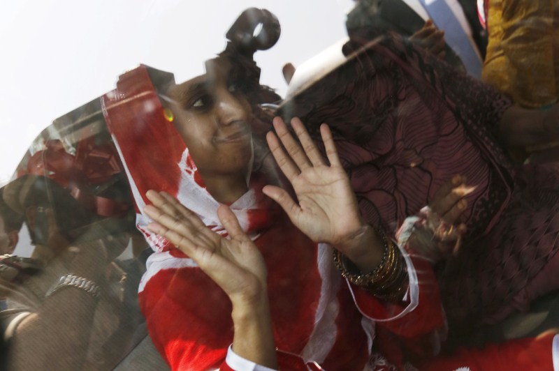 Geeta, a deaf-mute Indian woman who has been stranded in Pakistan for over a decade, arrived here on a flight from Pakistan. Geeta,Geeta lands in Delhi,Geeta lands in Delhi from Pakistan,Deaf-mute Geeta,IGI airport in Delhi,IGI airport