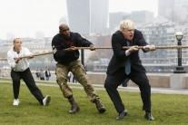 London mayor Boris Johnson has taken a tumble as he competed in a tug of war against members of the armed forces.