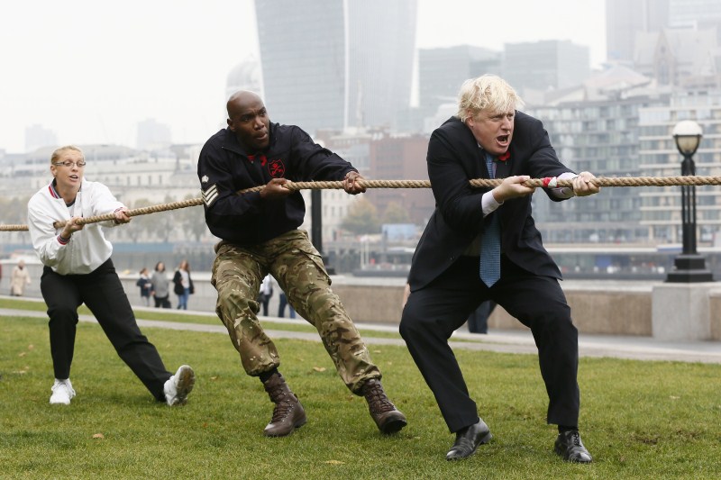 London mayor Boris Johnson has taken a tumble as he competed in a tug of war against members of the armed forces. London Poppy Day,London Poppy Day 2015,Boris Johnson,London mayor Boris Johnson,tug of war
