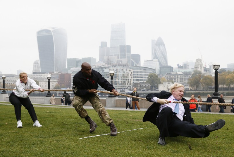 London mayor Boris Johnson has taken a tumble as he competed in a tug of war against members of the armed forces. London Poppy Day,London Poppy Day 2015,Boris Johnson,London mayor Boris Johnson,tug of war
