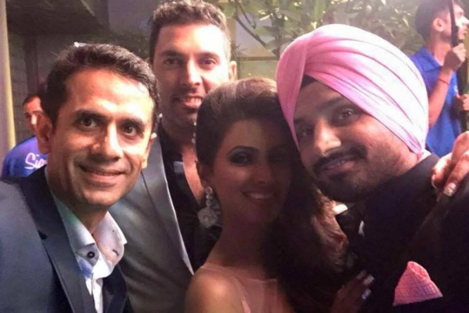 Harbhajan Singh and Geeta Basra wedding reception held at Hotel Taj Palace in New Delhi on Sunday evening (1st November). Cricket player Harbhajan Singh, married his long-time girlfriend and Bollywood actress Geeta Basra on 29 October. Dhoni, Anil Kumble, Ajinkya Rahane and his wife, Yuvraj Singh, Ajay Jadeja, Murali Vijay, Cheteshwar Pujara, Varun Aaron, Ravichandran Ashwin and his father, Team India Director Ravi Shastri and many others graced the event. Harbhajan Singh,Harbhajan Singh wedding reception,Harbhajan Singh and Geeta Basra Grand Reception,Geeta Basra Grand Reception,Geeta Basra,harbhajan singh geeta basra wedding,Virat Kohli