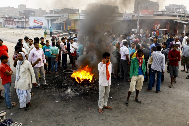 Nepalese Madhesi protestors burn tyres to block a highway connecting Nepal and India during a strike against the new constitution in Birgunj, Nepal on 5 November 2015. Birgunj Protest in Nepal,Birgunj Protest,Birgunj,Birgunj peoples,Madhesi protestors,Madhesi