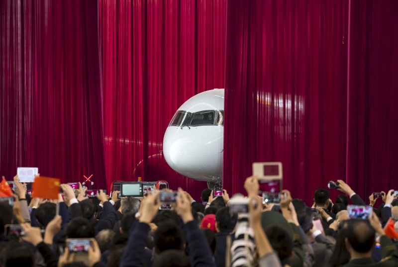The Commercial Aircraft Corp of China rolled out its C919 narrow body jet, which is meant to rival similar models from Airbus Group and Boeing Co. China unveils passenger jet,passenger jet,C919,C919 passenger jet,Commercial Aircraft Corp of China,Airbus Group and Boeing Co,first passenger jet