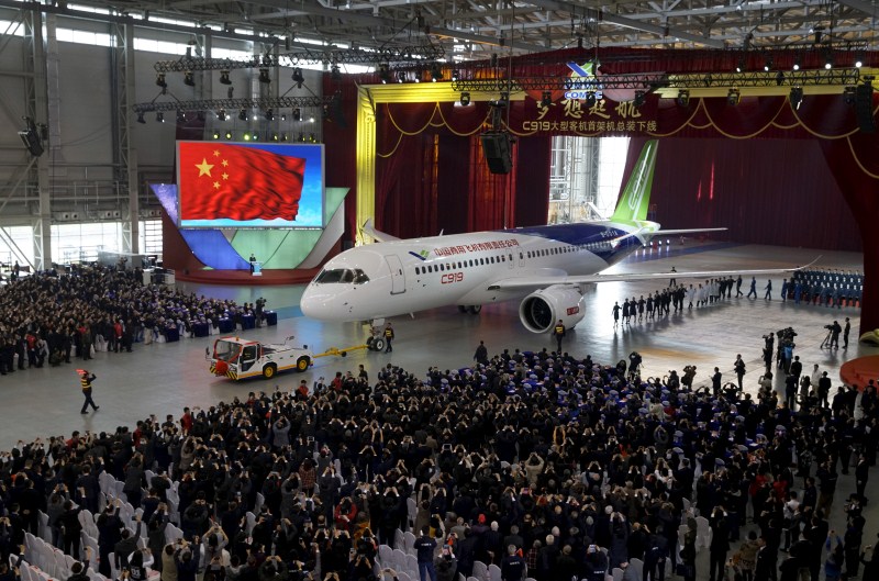 The Commercial Aircraft Corp of China rolled out its C919 narrow body jet, which is meant to rival similar models from Airbus Group and Boeing Co. China unveils passenger jet,passenger jet,C919,C919 passenger jet,Commercial Aircraft Corp of China,Airbus Group and Boeing Co,first passenger jet
