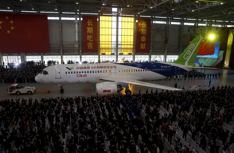 The Commercial Aircraft Corp of China rolled out its C919 narrow body jet, which is meant to rival similar models from Airbus Group and Boeing Co. China unveils passenger jet,passenger jet,C919,C919 passenger jet,Commercial Aircraft Corp of China,Airbus Group and Boeing Co,first passenger jet